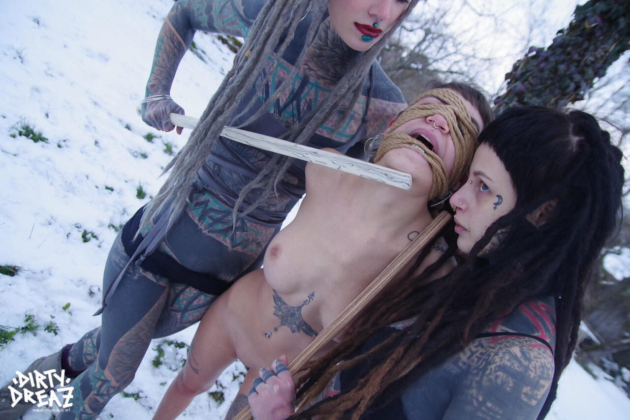 Heavily tatted girls torture a naked girl that is tied to a tree in the snow page 1