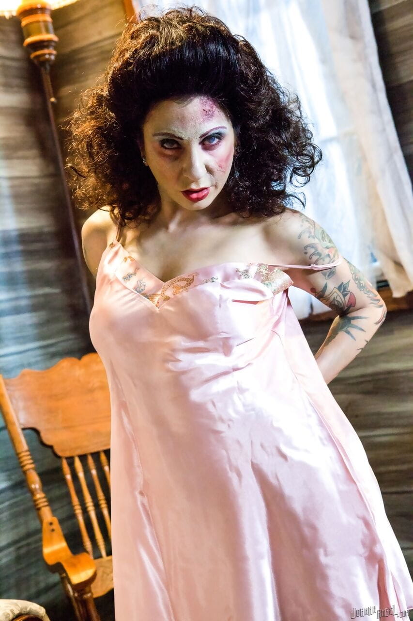 Scary looking chick Joanna Angel releases her firm tits from nightgown page 1