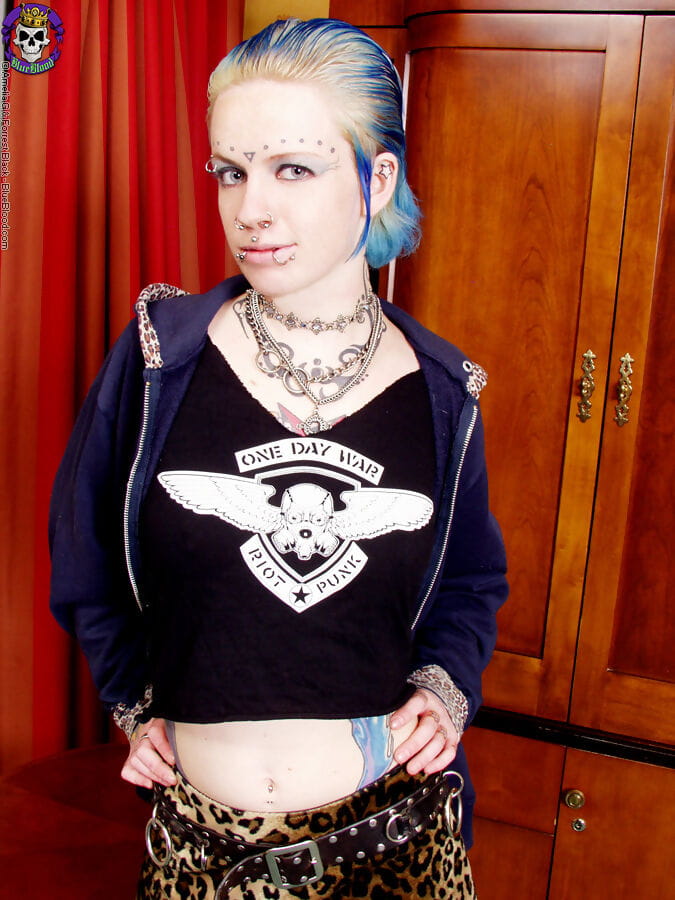 Punk teen Rachel Face shows her well tatted body in black nylons and garters page 1