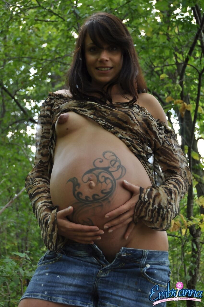 Pregnant amateur Brianna shows tits and twat plus swollen belly in the woods page 1