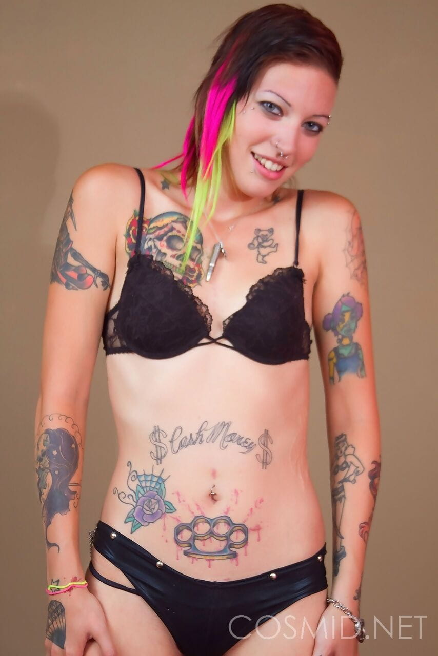 Punk girl Devon releases her tattooed body from her clothing in solo action page 1