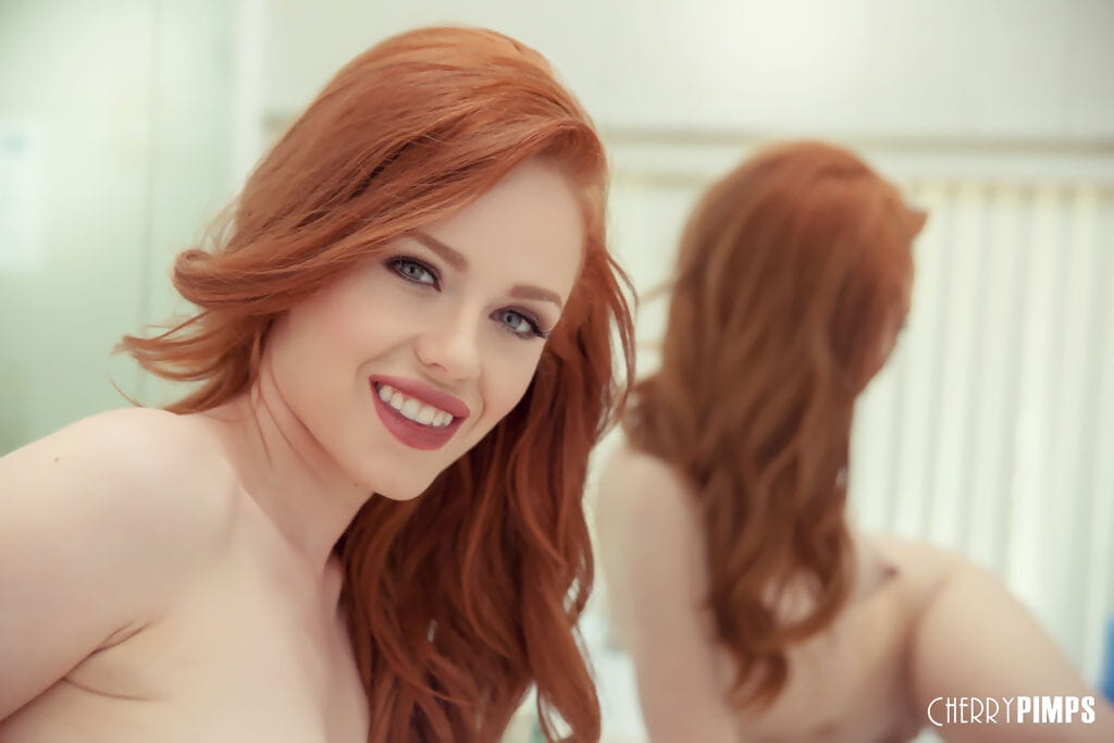 Sexy redhead Ella Hughes licks her fingers after they were inside her vagina page 1