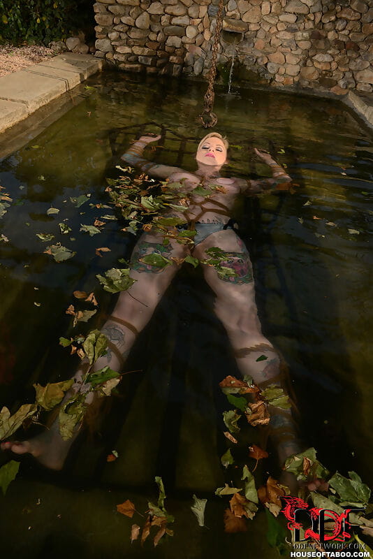 Tattooed chick Hollie Hatton is restrained and submerged in a pool of water page 1
