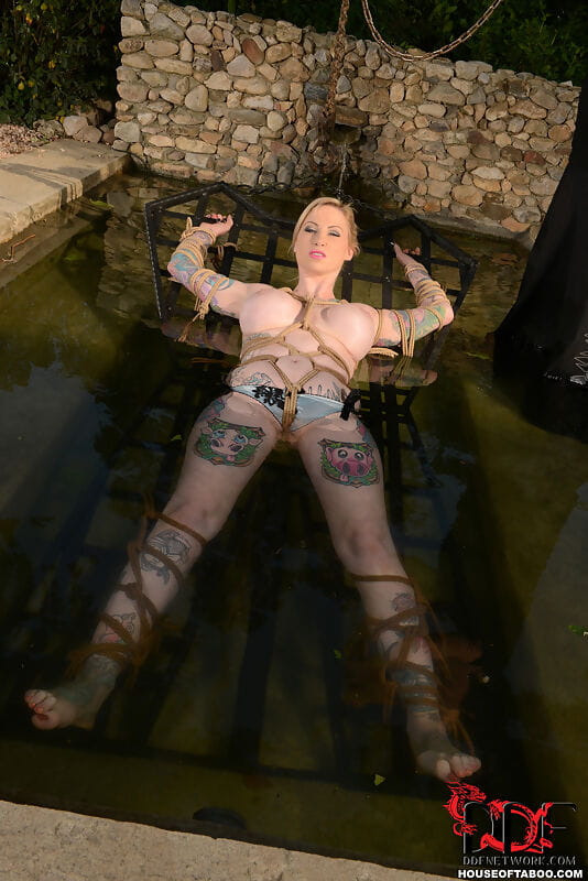 Tattooed chick Hollie Hatton is restrained and submerged in a pool of water page 1