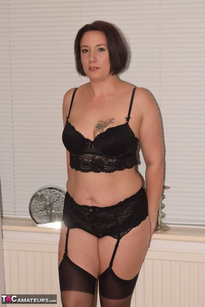 Older woman in three piece black lingerie and nylons exposes her small boobs page 1