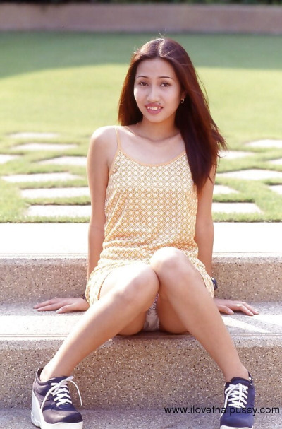 Asian cutie uncovering her sexy body and spreading her slender legs
