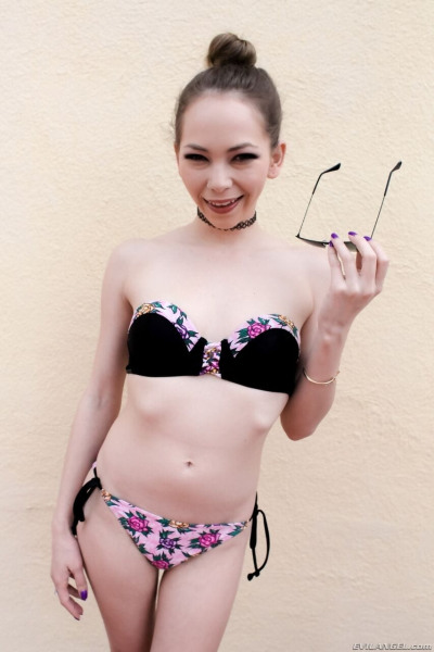 Petite girl Angel Smalls takes off her bikini before getting into a pool