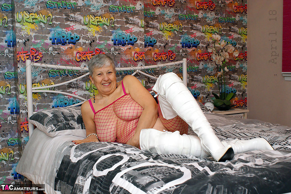 Bold granny Savana in thigh poses in fishnet body stocking & thigh high boots page 1