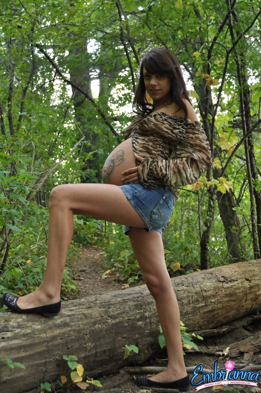 Pregnant amateur Brianna shows tits and twat plus swollen belly in the woods page 1