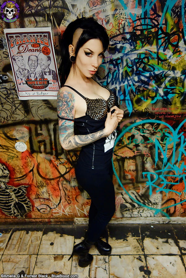 Goth girl Razor Candi strips to OTK boots in graffiti filled bathroom page 1