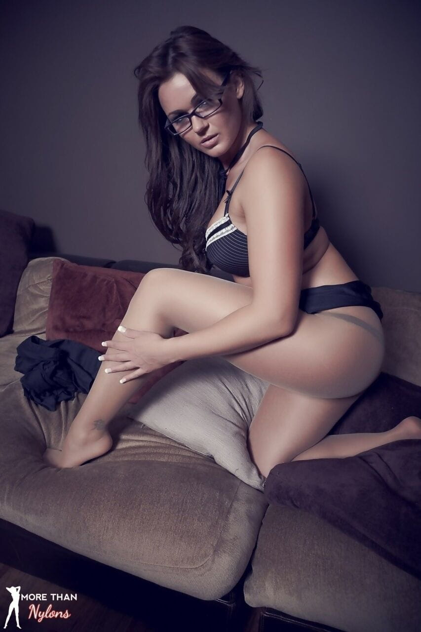 Glamour model Kat Dee blows a kiss wearing pantyhose and glasses page 1