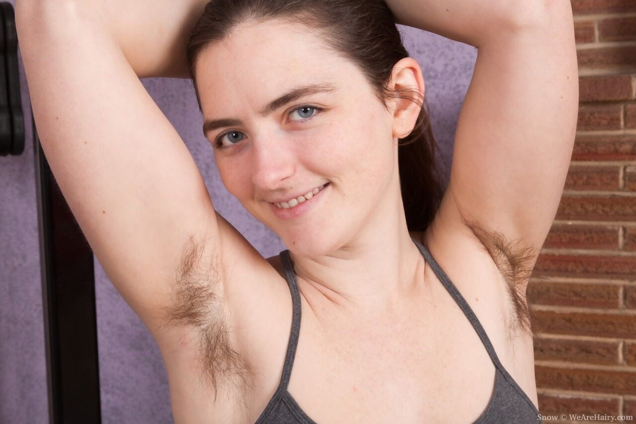 Amateur with big natural tits reveals unshaven pits and bush while disrobing page 1