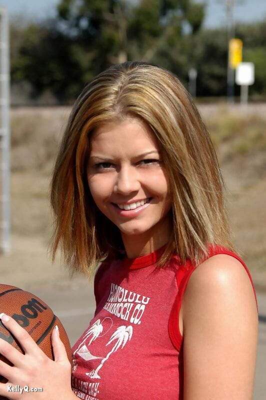 Cute teen Kellyq exposes her tits and ass while shooting hoops outdoors page 1