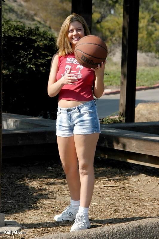 Cute teen Kellyq exposes her tits and ass while shooting hoops outdoors page 1